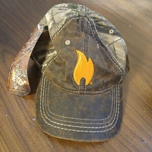 Realtree camo baseball cap featuring a distinctive orange fire emblem